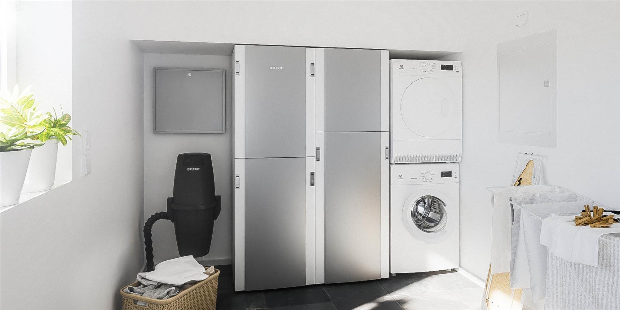 EcoNordic inneklimasentral installert i vaskerom sammen med vaskemaskin og tørketrommel